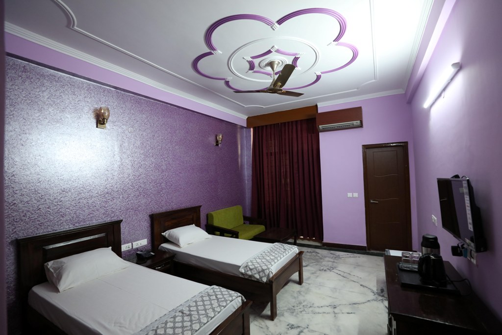 Twin-sharing accommodation room at Patanjali Wellness with modern amenities for a comfortable wellness stay