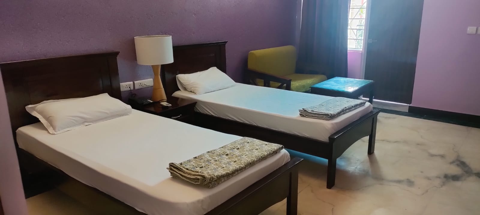 Twin-bed accommodation at Patanjali Wellness designed for a peaceful and comfortable wellness stay